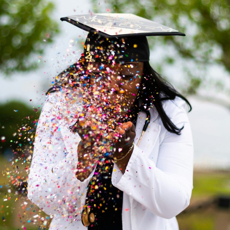 Vet graduate celebrating - but what are their veterinarian credentials?